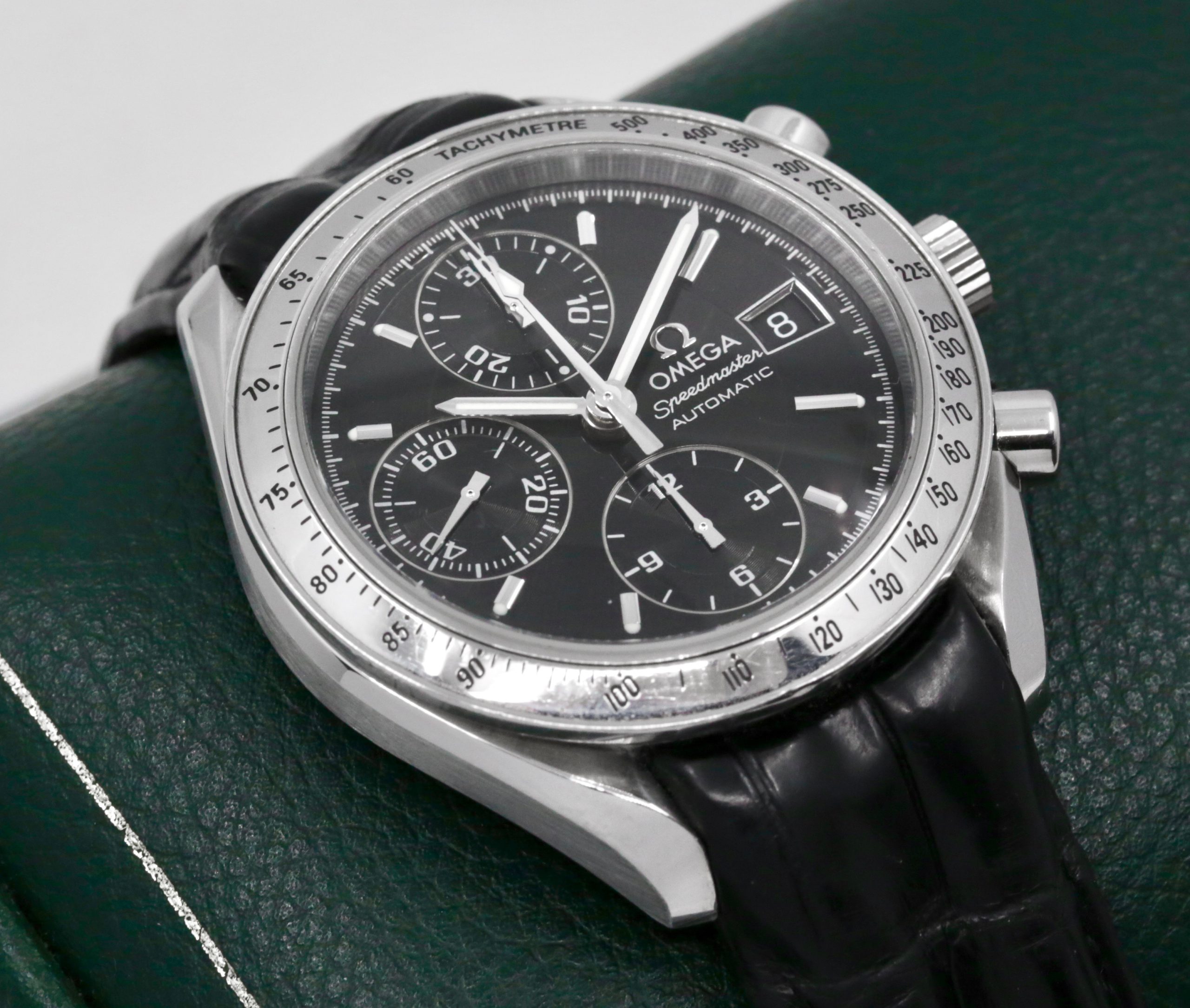 Omega Speedmaster Automatic with Date, Stainless Steel, Black Index & Black Sub Dials, on Black Omega Alligator Leather Strap with Stainless Steel Omega Deployant, Ref. 38135000, Circa: 1999, with Omega Booklets & Omega Warranty Card - $2,800