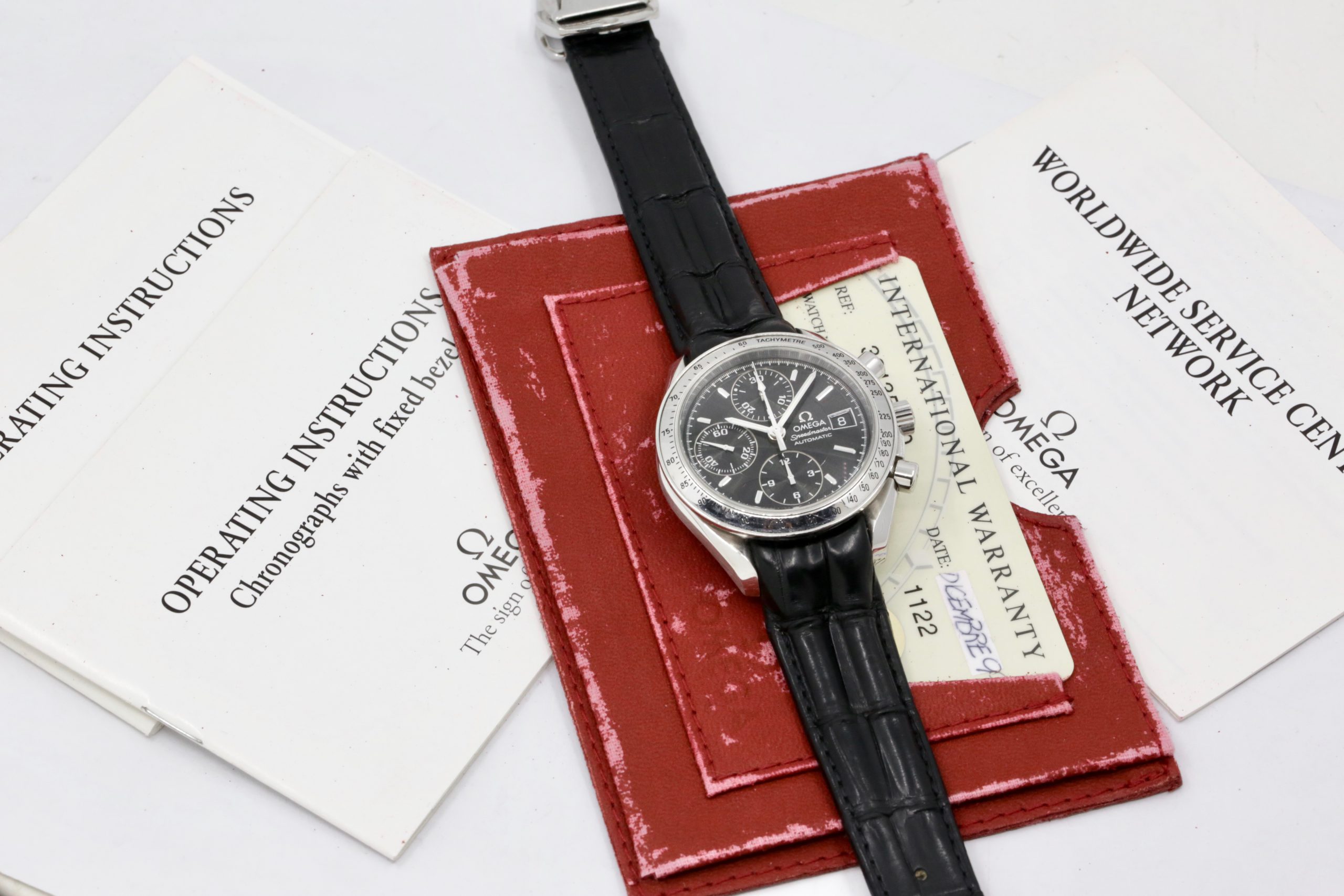 Omega Speedmaster Automatic with Date, Stainless Steel, Black Index & Black Sub Dials, on Black Omega Alligator Leather Strap with Stainless Steel Omega Deployant, Ref. 38135000, Circa: 1999, with Omega Booklets & Omega Warranty Card - $2,800 - Image 7