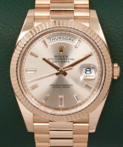 Rolex Day-Date 40, in 18ct Everose Gold, with Factory Set Sundust Baguette Diamond Dial, on 18ct Everose Gold Rolex President Bracelet, Ref. 228235, Circa: 2019, with Box, Books, Rolex Warranty Card, Rolex Service Card & Balance of 2 Year Rolex Service Warranty