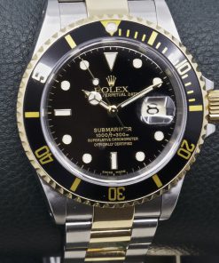 Rolex Oyster Perpetual Submariner Date, in Stainless Steel & 18ct Yellow Gold, Black Index Dial, on Stainless Steel & 18ct Yellow Gold Rolex Oyster Bracelet, Ref. 16613, Circa: 2002, with Box, books, Swing Tag, Anchor, and Rolex Warranty certificate
