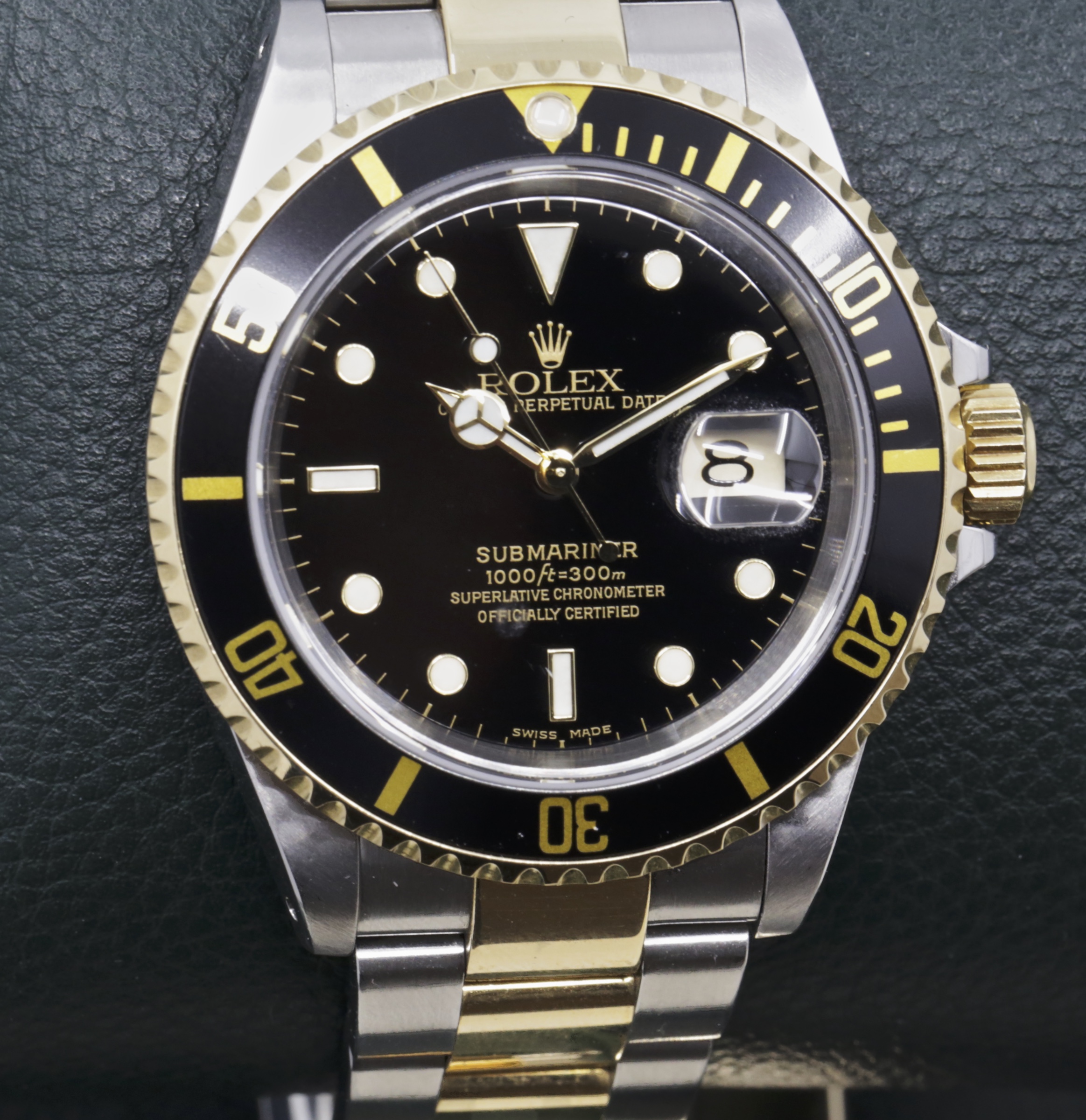 Rolex Oyster Perpetual Submariner Date, in Stainless Steel & 18ct Yellow Gold, Black Index Dial, on Stainless Steel & 18ct Yellow Gold Rolex Oyster Bracelet, Ref. 16613, Circa: 2002, with Box, books, Swing Tag, Anchor, and Rolex Warranty certificate