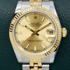 Rolex Oyster Perpetual Datejust 31, Stainless Steel & 18ct Yellow Gold, Fluted Bezel, Champagne Index Dial, on Stainless Steel & 18ct Yellow Gold Rolex Jubilee Bracelet, Ref. 178273, Circa: 2011, with Box, Books, Rolex Warranty Card, Rolex Service Card & Balance of 2 Year Rolex Service Warranty