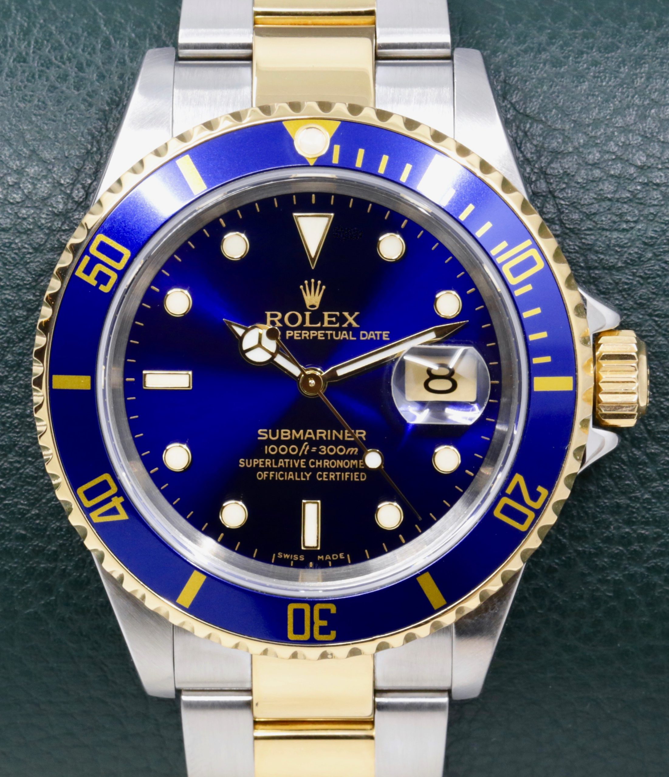 Rolex Submariner Date, Stainless Steel & 18ct Yellow Gold, Blue Index Dial, on Stainless Steel & 18ct Yellow Gold Rolex Oyster Bracelet, Ref. 16613, Circa: 2003, with Box, Books, & Rolex Warranty Certificate