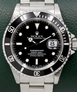 Rolex Submariner Date, Stainless Steel, Black Index Dial, Black Aluminum Bezel, on Stainless Steel Rolex Oyster Bracelet, Ref. 16610, Circa: 1996, with Box, Swing Tag, & Book