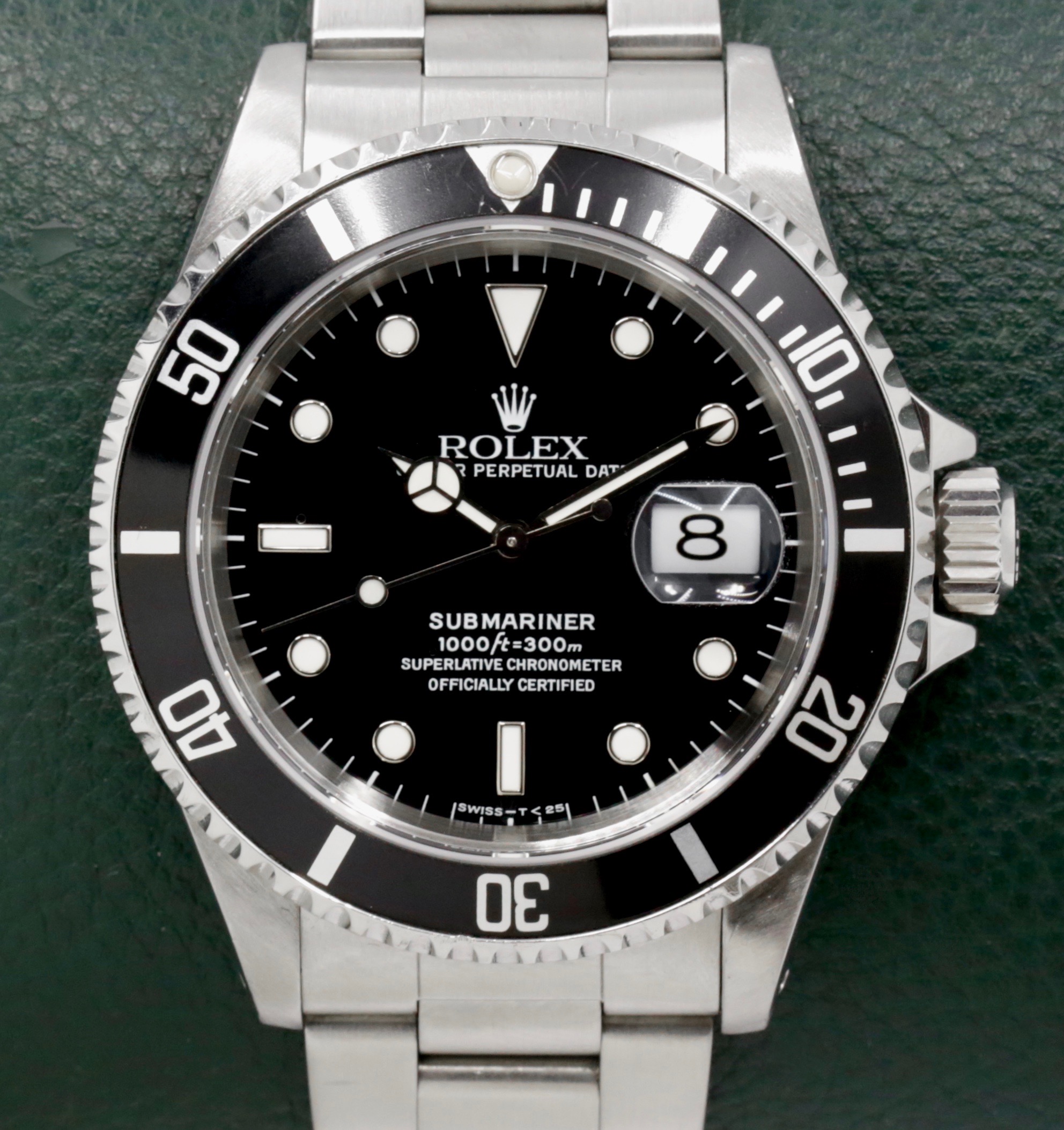 Rolex Submariner Date, Stainless Steel, Black Index Dial, Black Aluminum Bezel, on Stainless Steel Rolex Oyster Bracelet, Ref. 16610, Circa: 1996, with Box, Swing Tag, & Book