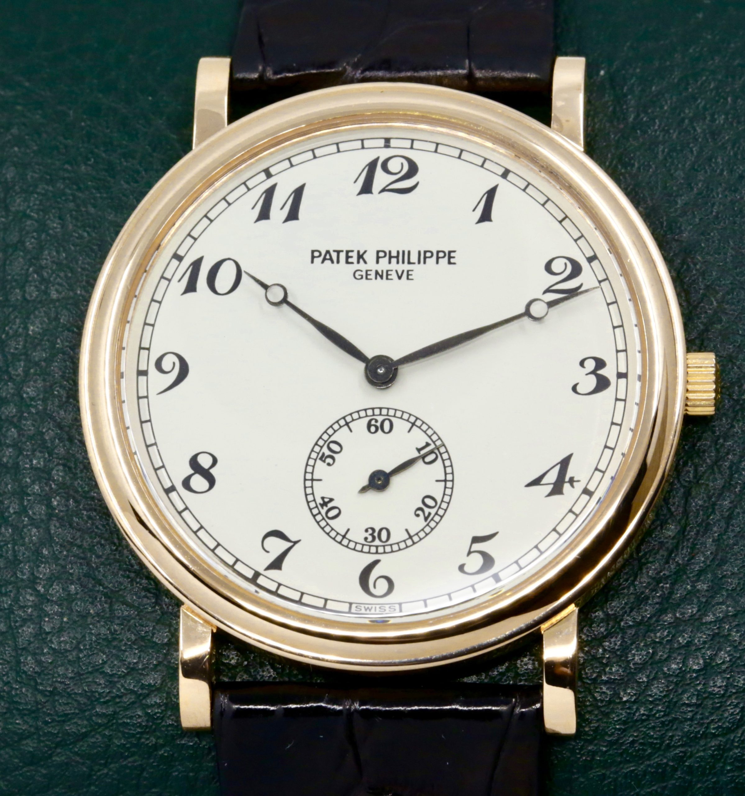 Patek Philippe Calatrava in 18ct Yellow Gold, Silver Dial with Breguet Markers, on Black Alligator Leather Strap with a Patek Philippe 18ct Yellow Gold Tang Buckle, Manual-Winding Calibre 215 PS, Ref: 5022J Ca: 2000
