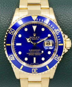 Rolex Oyster Perpetual Submariner Date, in 18ct Yellow Gold, with Blue Index Dial, Blue Aluminum Bezel, on 18ct Yellow Gold Rolex Oyster Bracelet,  Ref. 16618, Circa: 2006, with Box, Rolex Service Card & Balance of 2 Year Rolex Service Warranty