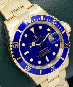 Alternative view of Rolex Oyster Perpetual Submariner Date, in 18ct Yellow Gold, with Blue Index Dial, Blue Aluminum Bezel, on 18ct Yellow Gold Rolex Oyster Bracelet,  Ref. 16618, Circa: 2006, with Box, Rolex Service Card & Balance of 2 Year Rolex Service Warranty