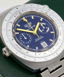 Heuer Chronograph "Calculator Watch" in Stainless steel,  Calculator Bezel, Blue index dial with Date,  Heuer Stainless Steel bracelet,  Reference 110.633  Ca. 1971 est.