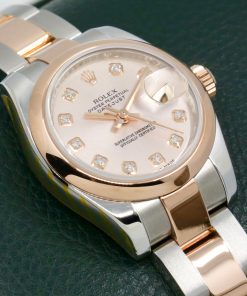 Rolex Lady-Datejust 26 in Stainless Steel & 18ct Everose Gold.  Factory Set Sundust Diamond Dial, Smooth 18ct Everose Bezel on a Stainless Steel and 18ct Everose gold Rolex Oyster Bracelet, Ref. 179161, Circa: 2010, with Box, Papers, Rolex Service Card & Balance of 2 Year Rolex Service Warranty