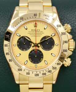Rolex Cosmograph Daytona, in 18ct Yellow Gold, with "Paul Newman" Champagne Index Dial with Black Sub Dials on 18ct Yellow Gold Rolex Oyster Bracelet, Ref. 116528, Circa: 2002, with Rolex Box, Books, & Rolex Service Card