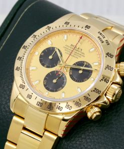 Alternative view of Rolex Cosmograph Daytona, in 18ct Yellow Gold, with "Paul Newman" Champagne Index Dial with Black Sub Dials on 18ct Yellow Gold Rolex Oyster Bracelet, Ref. 116528, Circa: 2002, with Rolex Box, Books, & Rolex Service Card