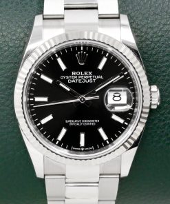 Rolex Oyster Perpetual Datejust 36, Stainless Steel, 18ct White Gold Fluted Bezel, Black Index Dial, on Stainless Steel Rolex Oyster Bracelet, Ref. 126234, Circa: 2024, with Box, Books, Rolex Warranty Card, & Balance of 5 Year Rolex Factory Warranty