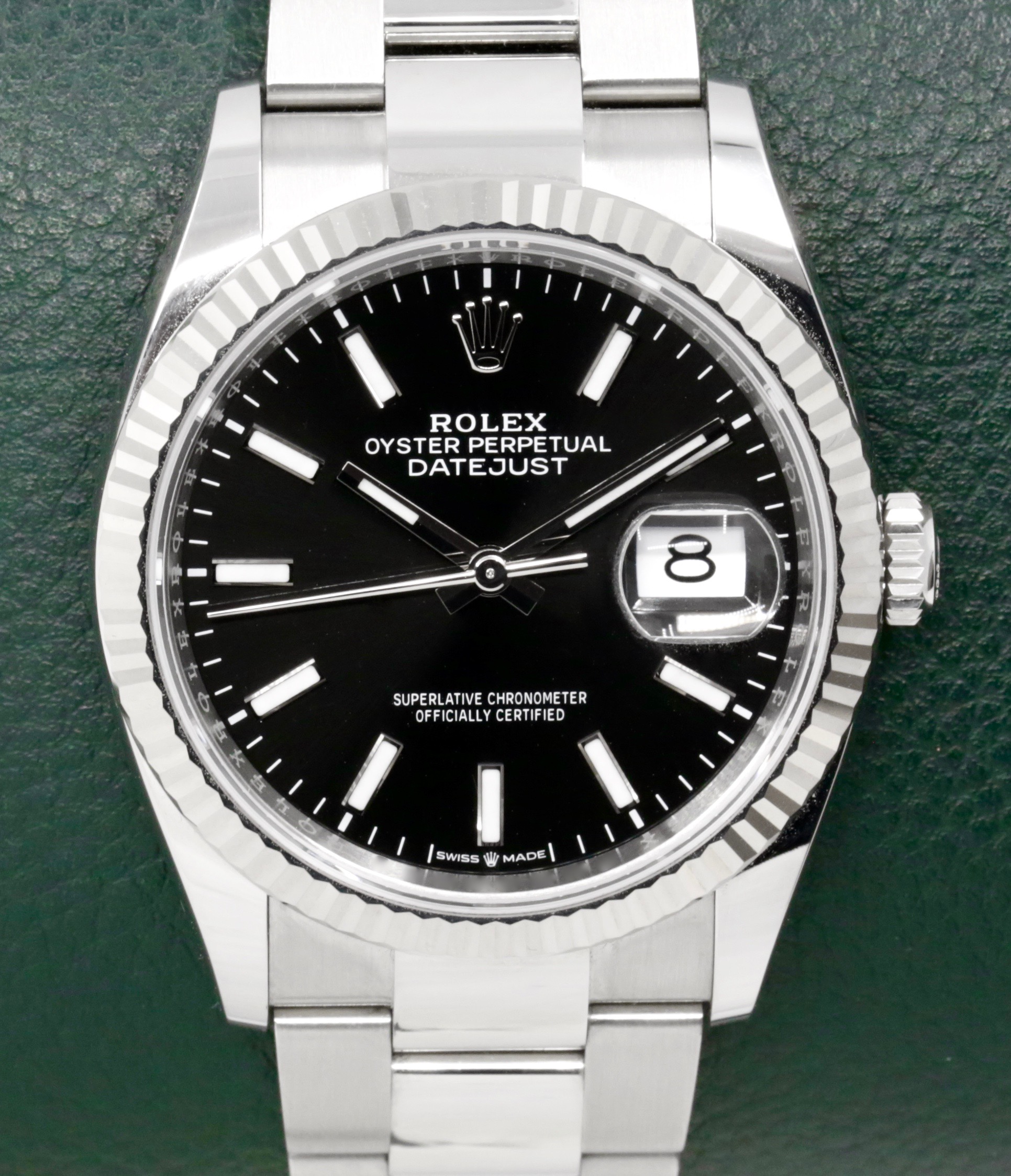 Rolex Oyster Perpetual Datejust 36, Stainless Steel, 18ct White Gold Fluted Bezel, Black Index Dial, on Stainless Steel Rolex Oyster Bracelet, Ref. 126234, Circa: 2024, with Box, Books, Rolex Warranty Card, & Balance of 5 Year Rolex Factory Warranty