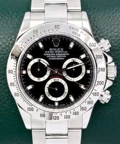 Rolex Cosmograph Daytona in Stainless Steel, Black Index Dial, on Stainless Steel Rolex Oyster Bracelet, Ref. 116520, D-Serial Circa: 2005, with Box, Book, & Rolex Service Card - Excellent Condition, Case Back Still with Original Sticker