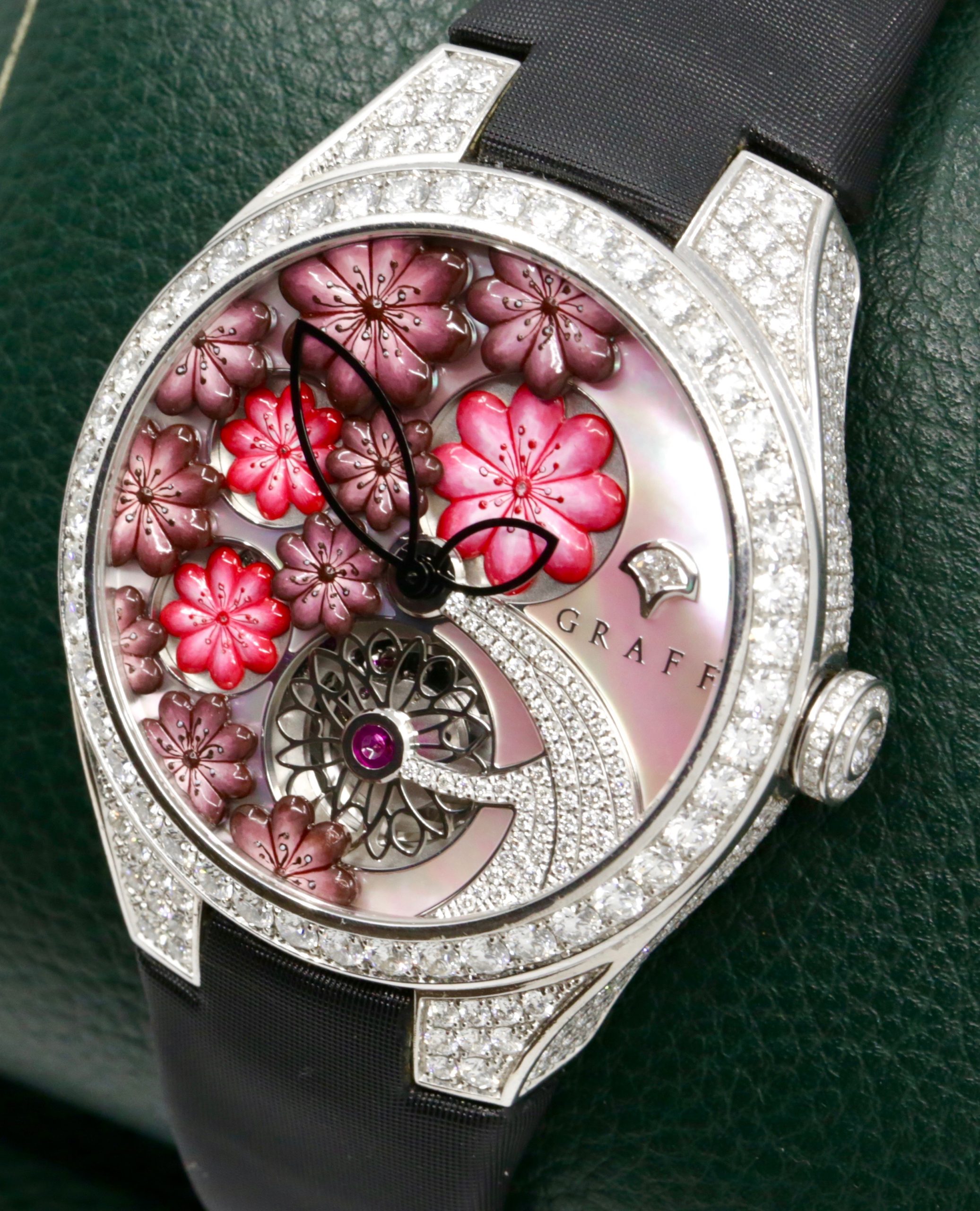 The Graff Floral Automatic Watch in 18ct White Gold, Set with Factory Diamonds on the Case, Lugs, Crown and Bezel, with Mother of Pearl Dial Set with a Floral Design and Diamonds, on a Graff Satin Band with Factory Diamond Set Tang Buckle. Ref: GFA37WGSLD, Box, Book, Additional Graff Satin Strap and Graff Warranty Card. - Image 2