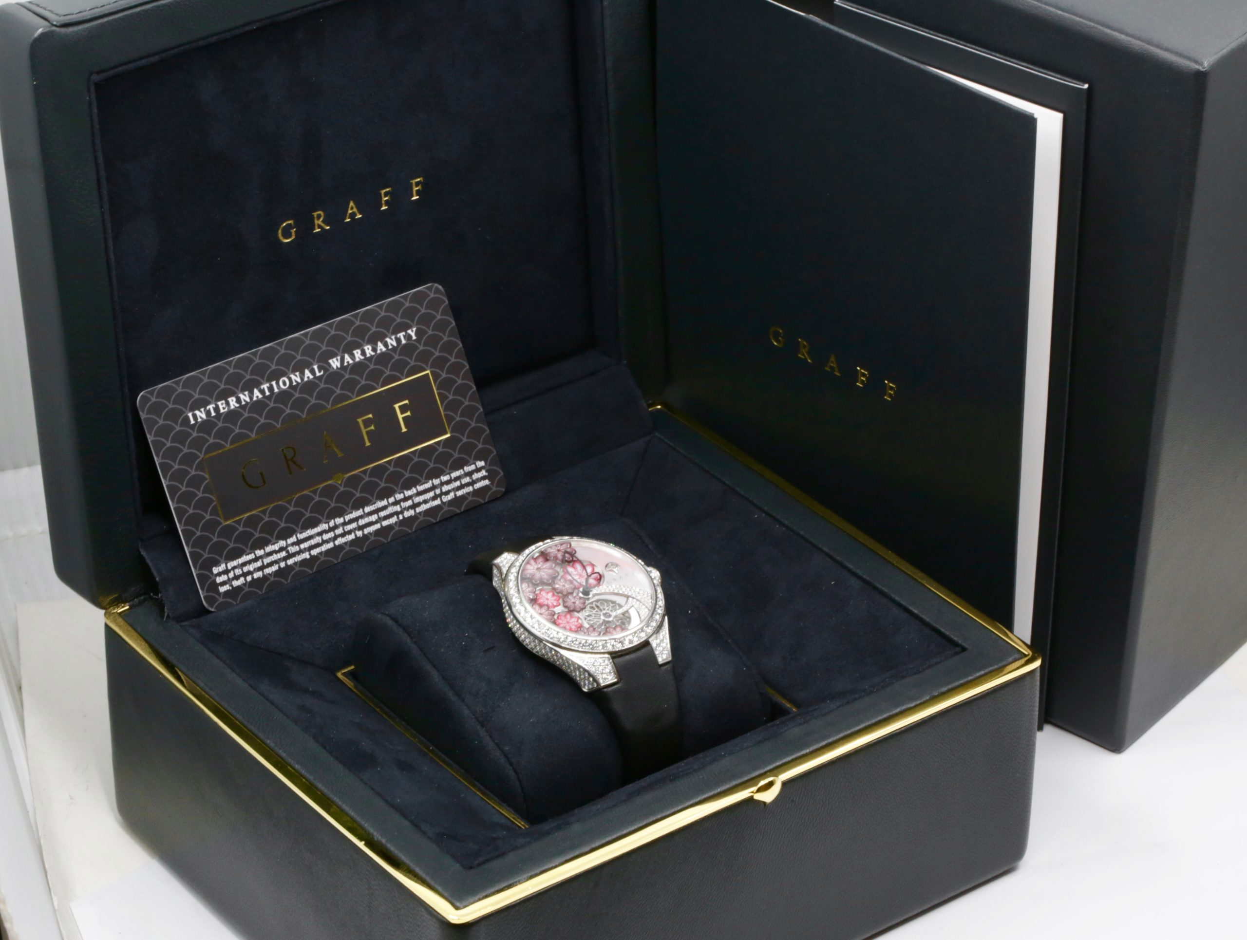 The Graff Floral Automatic Watch in 18ct White Gold, Set with Factory Diamonds on the Case, Lugs, Crown and Bezel, with Mother of Pearl Dial Set with a Floral Design and Diamonds, on a Graff Satin Band with Factory Diamond Set Tang Buckle. Ref: GFA37WGSLD, Box, Book, Additional Graff Satin Strap and Graff Warranty Card. - Image 13