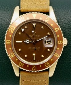 RARE!! Rolex GMT Master, in 18ct Yellow Gold, No Crown Guard Case, Brown Aluminium Bezel, Brown Nipple Dial, on Suede Strap with Yellow Gold Rolex Tang Buckle, Ref. 1675, Circa: 1965, with Rolex Box & Rolex Service Invoice