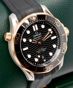 Alternative view of Omega Seamaster Diver 300M, 42mm, Stainless Steel & 18ct Sedna™ Gold, Black Wave Index Dial, on Black Omega Rubber Strap with Stainless Steel Omega Tang Buckle, Ref. 210.22.42.20.01.002, Circa: 2022, Complete with Box, Books, Omega Warranty Cards & Balance of 5 Year Omega Factory Warranty