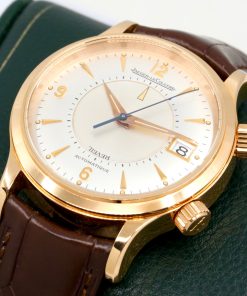 Alternative view of Jaeger-LeCoultre Reveil, in 18ct Rose gold Sliver sunburst dial with Arab and index markers; the inner section of the dial rotates to allow the mechanical alarm to be set. Ref: 141297 Automatic calibre 916, Brown JLC band with an 18ct rose gold deployant Watch only Ca: 2000’s