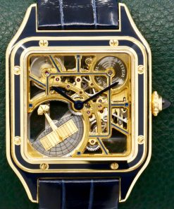 Cartier Santos Dumont Skeleton Watch with Micro-Rotor, in 18ct Yellow Gold with Navy Blue Enamelling, on Navy Blue Cartier Alligator Strap with 18ct Yellow Gold Cartier Tang Buckle, Ref. WHSA0031, Circa: 2024, with Box, Papers & Balance of 8 Year extended Cartier Factory Warranty. "This model is Limited to 150 pieces"