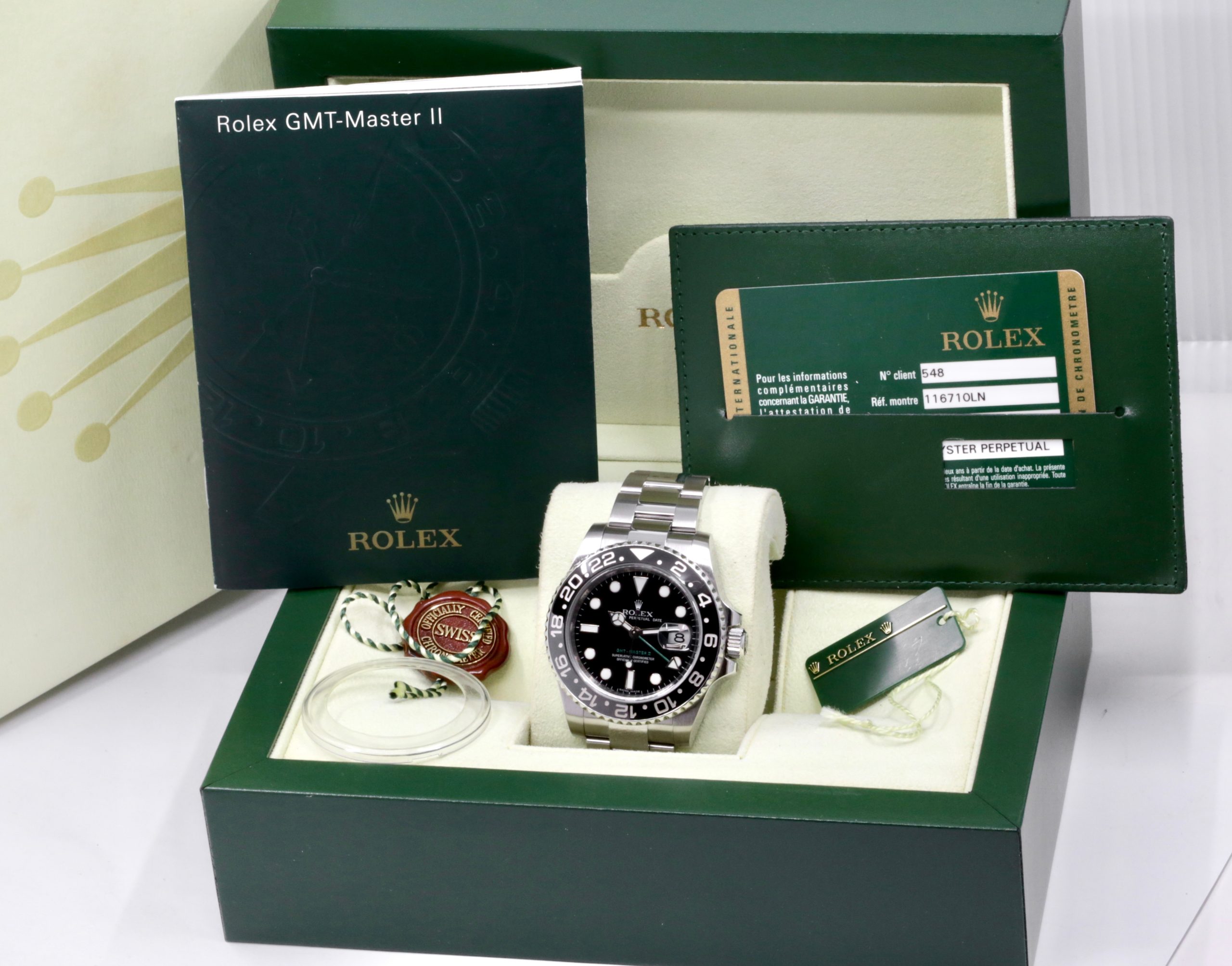 Rolex GMT-Master II "Green Arrow", in Stainless Steel, Black Ceramic Bezel, Black Index Dial, on Stainless Steel Oyster Bracelet, Ref. 116710LN, Circa: 2009, with Box, Books, Swing Tag, & Rolex Warranty Card - Image 7