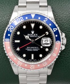 Rolex GMT-Master II "Pepsi", Stainless Steel, Blue & Faded Red Aluminum Bezel, Black Index Dial, on Stainless Steel Rolex Oyster Bracelet, Ref. 16710, Circa: 2000, with Box & Booklets and Rolex Service Card