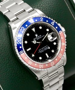 Alternative view of Rolex GMT-Master II "Pepsi", Stainless Steel, Blue & Faded Red Aluminum Bezel, Black Index Dial, on Stainless Steel Rolex Oyster Bracelet, Ref. 16710, Circa: 2000, with Box & Booklets and Rolex Service Card