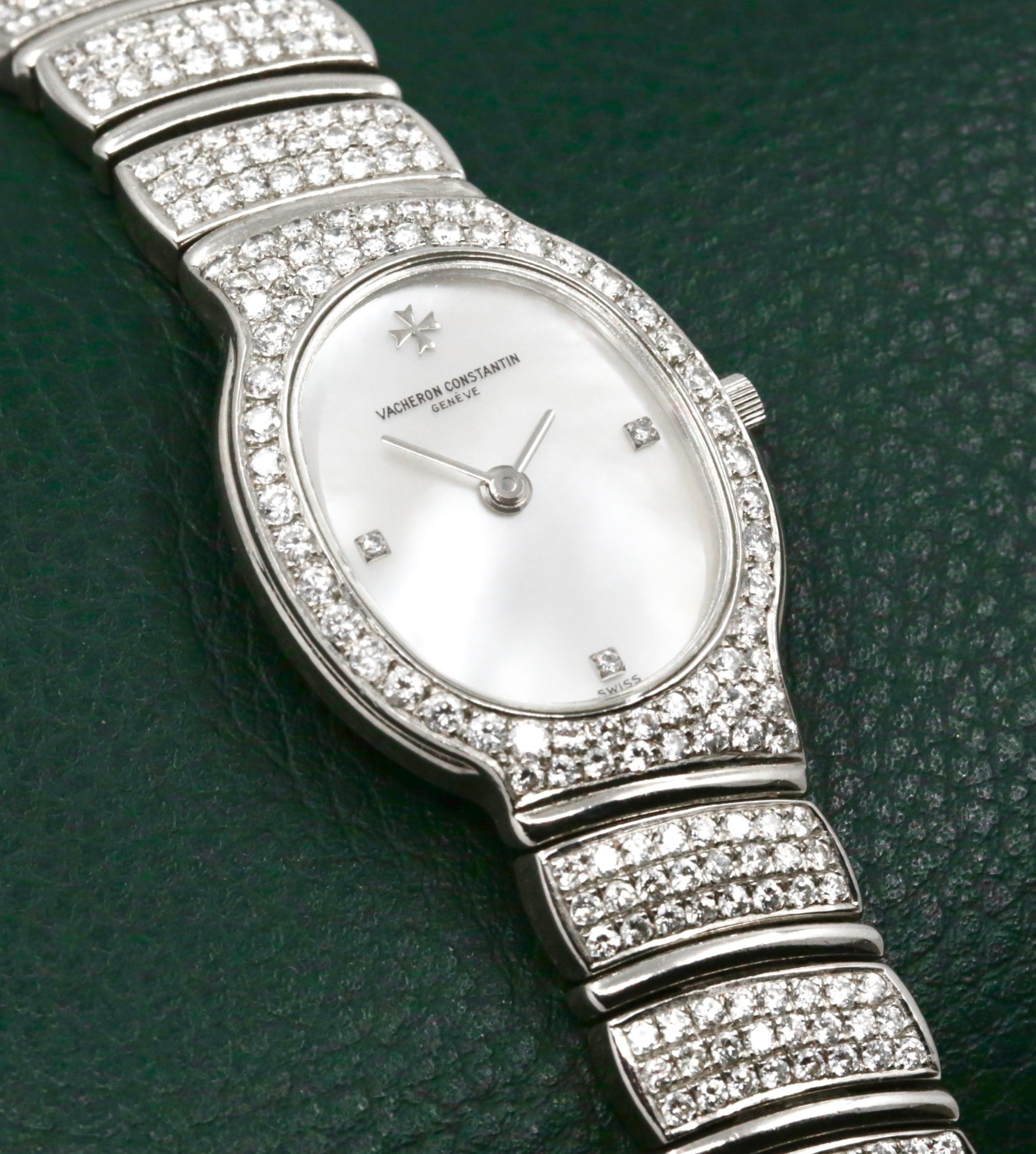 Vacheron Constantin Ladies Watch in 18ct White Gold, Diamond Set Bezel with a Mother Of Pearl Dial Set with Diamonds at 3, 6, 9. Integrated 18ct White Gold Bracelet Set with Diamonds. Ref: 27036/PB is part of the Absolues Collection with a Quartz Movement. Circa 1990's