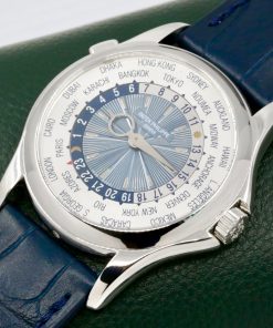 Alternative view of Patek Philippe World Time, Ref. 5130P, in Platinum (950Pt), 39.5mm Case, Silver & Blue Sunburst Guilloché Dial, on Navy Blue Alligator Patek Philippe Leather Strap with Platinum Patek Deployant, Circa: 2011, with Patek Philippe Extract of Archives Certificate & Balance of 2 Year Patek Philippe Service Warranty