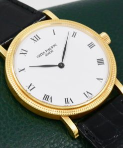 Patek Philippe Calatrava, Ref.3992J, Automatic, (0.750) 18ct Yellow Gold, Hobnail Bezel, White Acrylic Enamel Dial, on Black Patek Philippe Leather Strap with 18ct Yellow Gold Patek Tang Buckle
