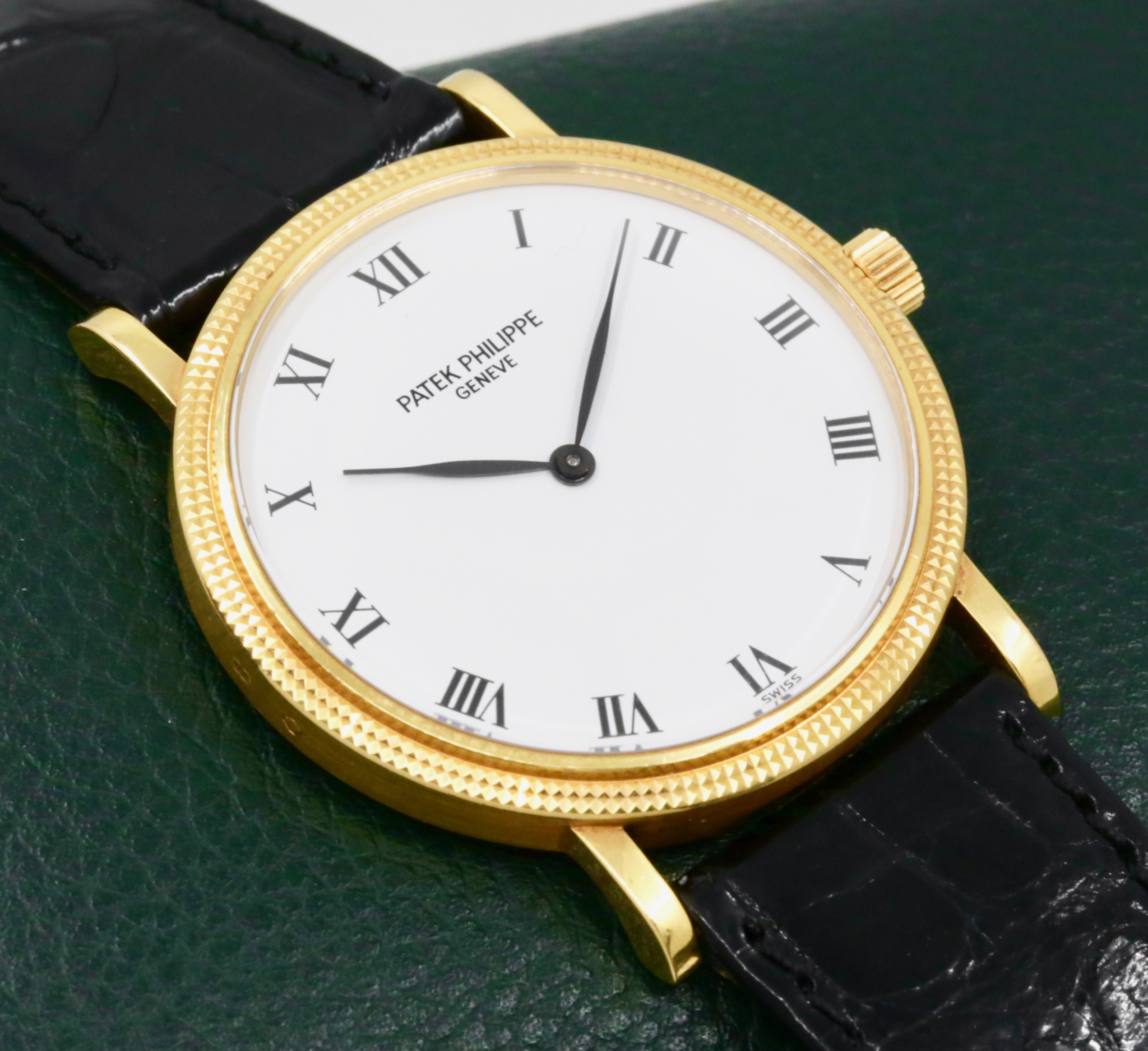 Patek Philippe Calatrava, Ref.3992J, Automatic, (0.750) 18ct Yellow Gold, Hobnail Bezel, White Acrylic Enamel Dial, on Black Patek Philippe Leather Strap with 18ct Yellow Gold Patek Tang Buckle