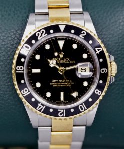 Rolex Oyster Perpetual GMT Master 2 in stainless steel & 18Ct Yellow gold, Black Index dial on a Rolex Steel and 18ct Yellow gold Oyster bracelet  with Box, Book, Tags and Rolex Warranty Paper. Ca2004