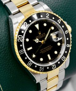 Alternative view of Rolex GMT-Master II in Stainless Steel & 18ct Yellow Gold, Black Index Dial, Black Aluminium Bezel, on Stainless Steel & 18ct Yellow Gold Bracelet, Ref. 16713, Circa: 2004, with Box, Books, Swing Tags & Rolex Warranty Certificate
