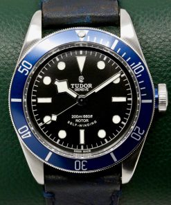 Tudor Heritage Black Bay "Smiley", 41mm Stainless Steel Case, Black Index Dial, Blue Aluminium Bezel, on Black Tudor Leather Strap with Stainless Steel Tudor Deployant, Ref. 79220B, Circa: 2014, Complete with Box, Books, Tudor Warranty Card & Tudor Service Card