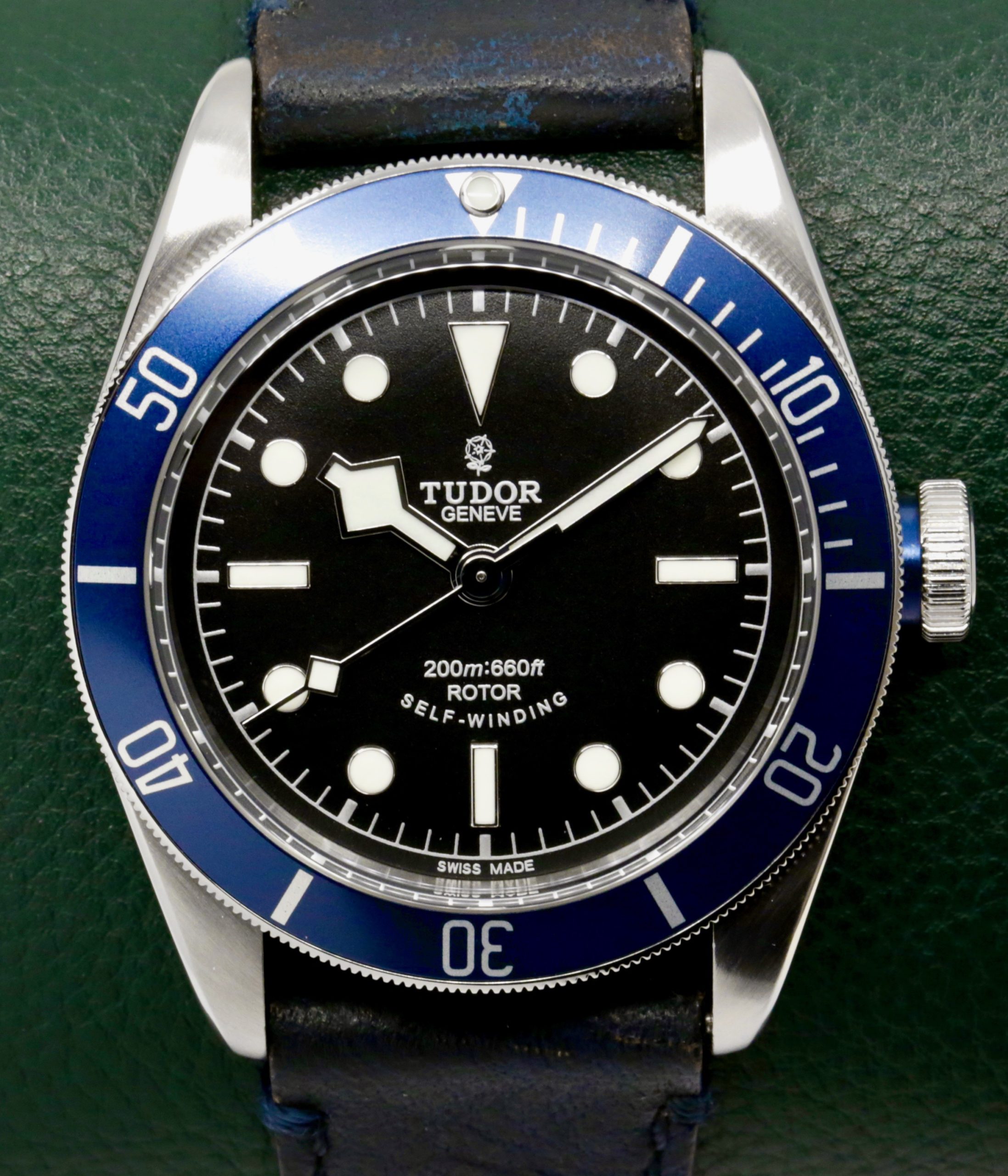 Tudor Heritage Black Bay "Smiley", 41mm Stainless Steel Case, Black Index Dial, Blue Aluminium Bezel, on Black Tudor Leather Strap with Stainless Steel Tudor Deployant, Ref. 79220B, Circa: 2014, Complete with Box, Books, Tudor Warranty Card & Tudor Service Card