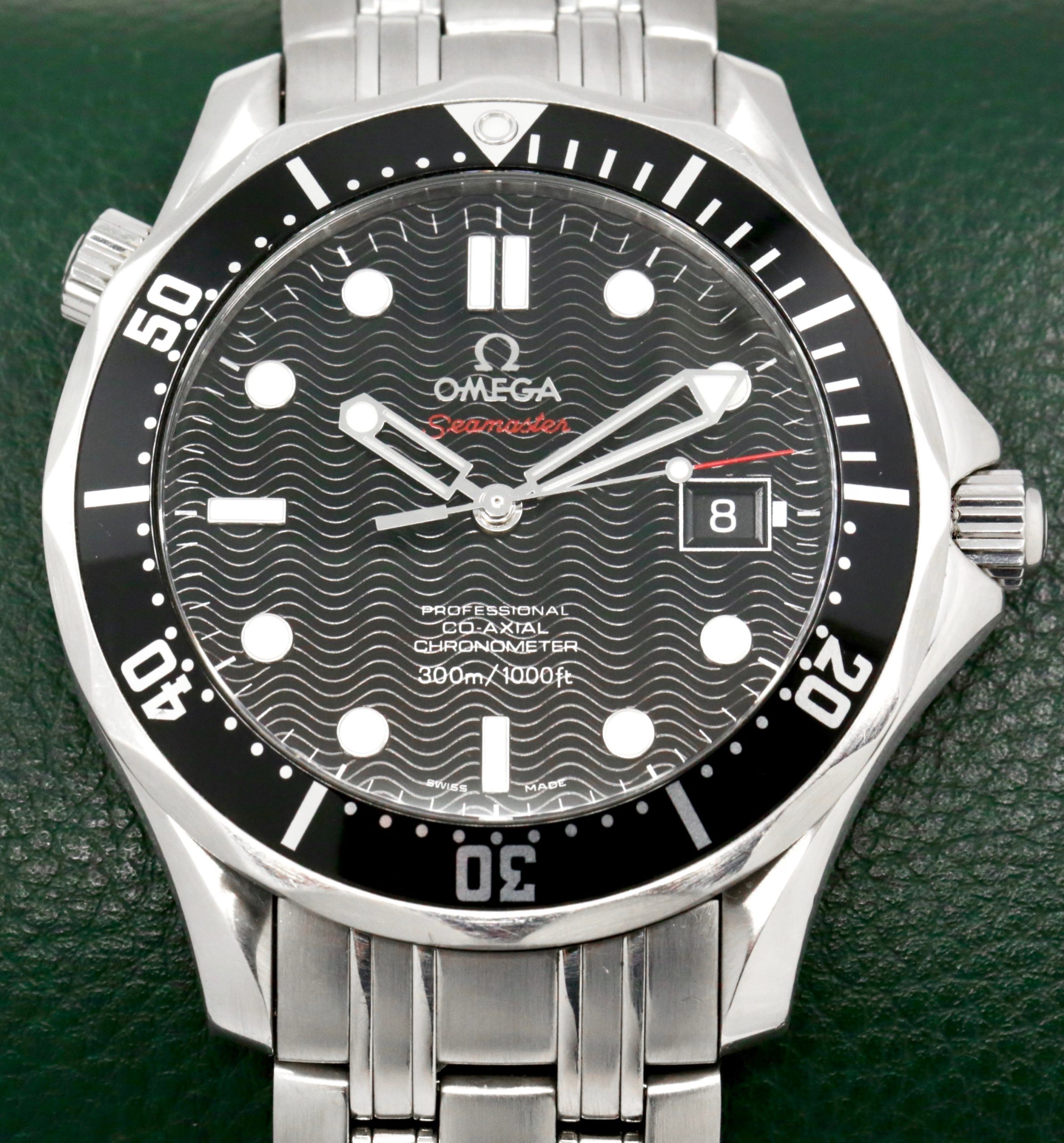 Omega Seamaster 300 in stainless steel, black index laser-engraved wave motif dial with a black 60 minute bezel on an Omega stainless steel bracelet Ref 212.30.41.20.01.002, Watch Only Ca 2012 (est)