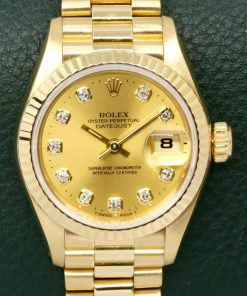Rolex Lady-Datejust 26, in 18ct Yellow Gold, Fluted Bezel, with Factory Set Champagne Diamond Dial, on 18ct Yellow Gold Rolex President Bracelet, Ref. 69178, Circa: 1991, with Box, Rolex Folder & Calendar