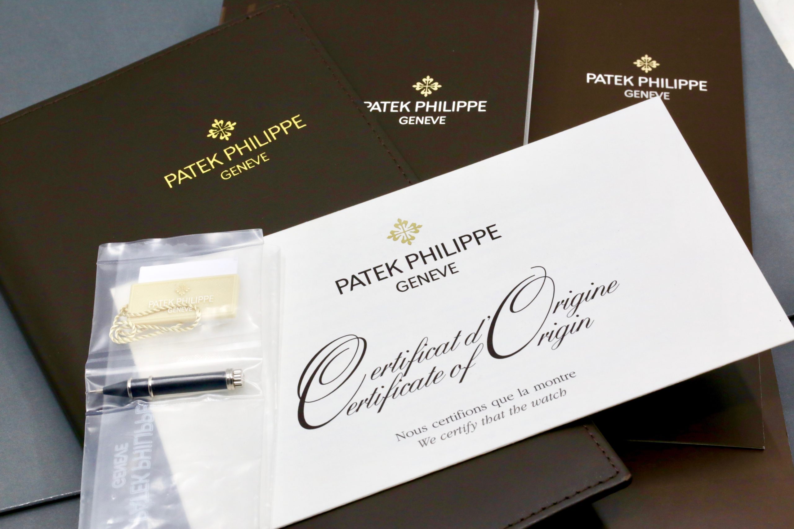 Patek Philippe Ref. 5205G-010 Annual Calendar, in 18ct White Gold, with Grey & Black Index Dial, Day, Date, Month, & Moon Phase Display, on Black Patek Philippe Alligator Strap with 18ct White Gold Patek Philippe Tang Buckle, Sold New in 2012, with Box & Papers - Image 8