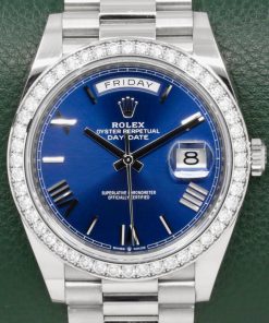 Rolex Day-Date 40, in 18ct White Gold, with Factory Set Diamond Bezel, Blue Roman Dial, on 18ct White Gold Rolex President Bracelet, Ref. 228349RBR, Circa: 2021, with Box, Books, Green & White Swing Tags, & Rolex Warranty Card