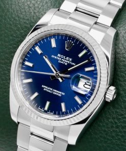 Alternative view of Rolex Oyster Perpetual Date 34 in Stainless Steel, 18ct White Gold Fluted Bezel, Blue Index Dial, Rolex Oystersteel Bracelet, Ref. 115234, Circa: 2021, with Box, Books, & Rolex Warranty Card