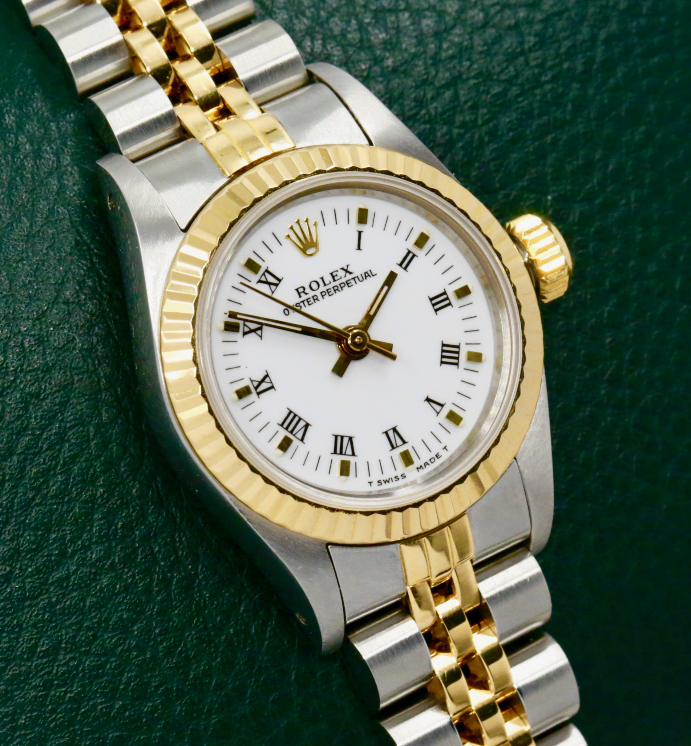 Rolex Oyster Perpetual 24mm in Stainless Steel and 18ct Yellow Gold, 18ct Yellow Gold Fluted Bezel, White Roman Dial on a Rolex Jubilee Bracelet. Ref. 67193, Circa 1990 with Box, Books, Swing Tag, Rolex Folder and Rolex Warranty Certificate - $6,950 inc GST!!