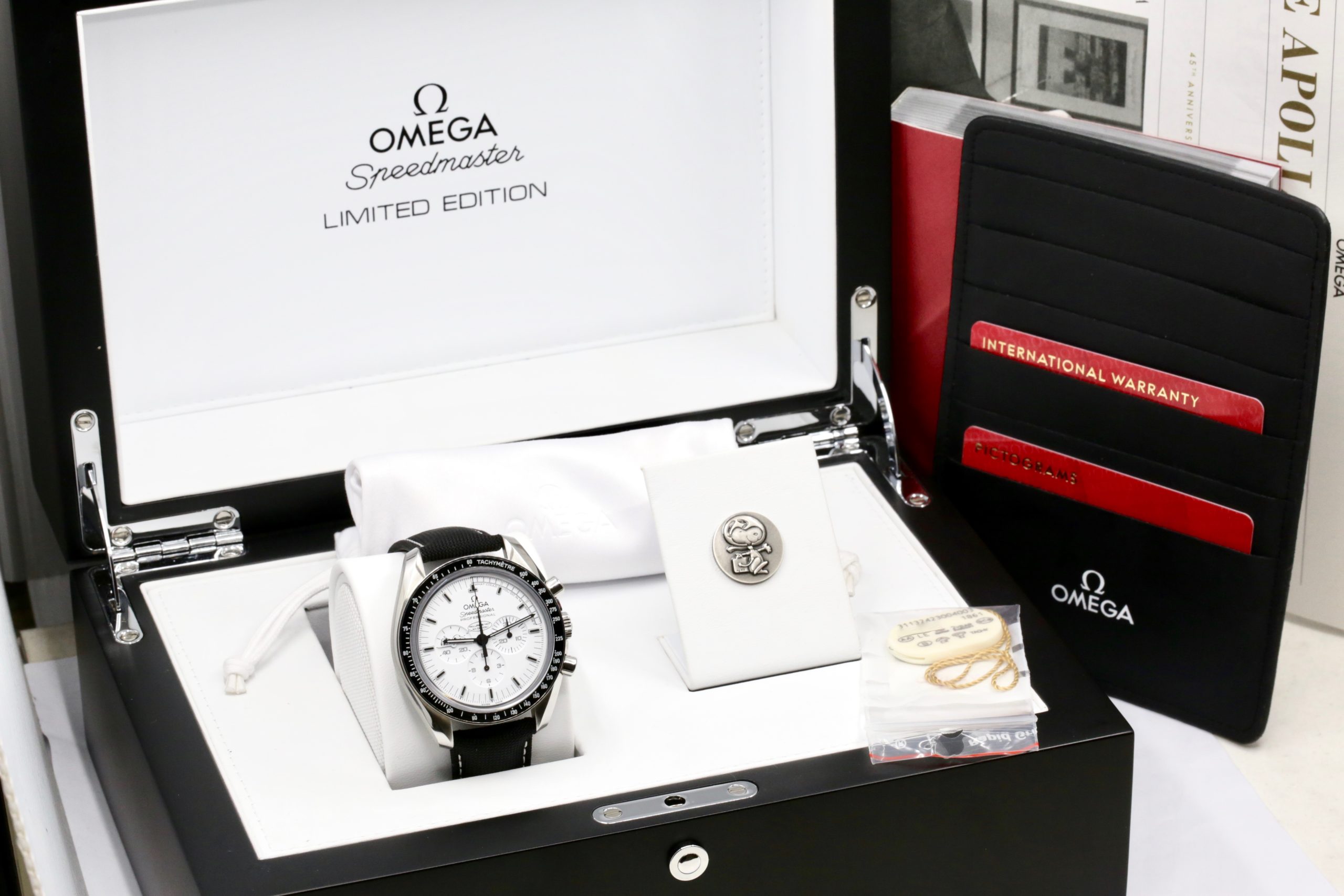 Omega Speedmaster Professional "Silver Snoopy Award" 45th Anniversary of Apollo 13, Stainless Steel Case, White Index Dial, on Omega Composite Fabric Strap with Stainless Steel Omega Deployant, Ref. 311.32.42.30.04.003, Circa: 2016, Complete with Box, Books & Omega Warranty Cards - Image 10