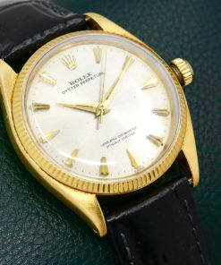 Alternative view of Rolex Oyster Perpetual in 18ct Yellow Gold , 18ct Fluted Bezel, Silver Index Dial, Rolex Calibre 1560, on a Black Leather Strap with a Rolex Gold Buckle. Ref: 1005, Ca. 1960's - $5,500 inc GST - *Sold as traded