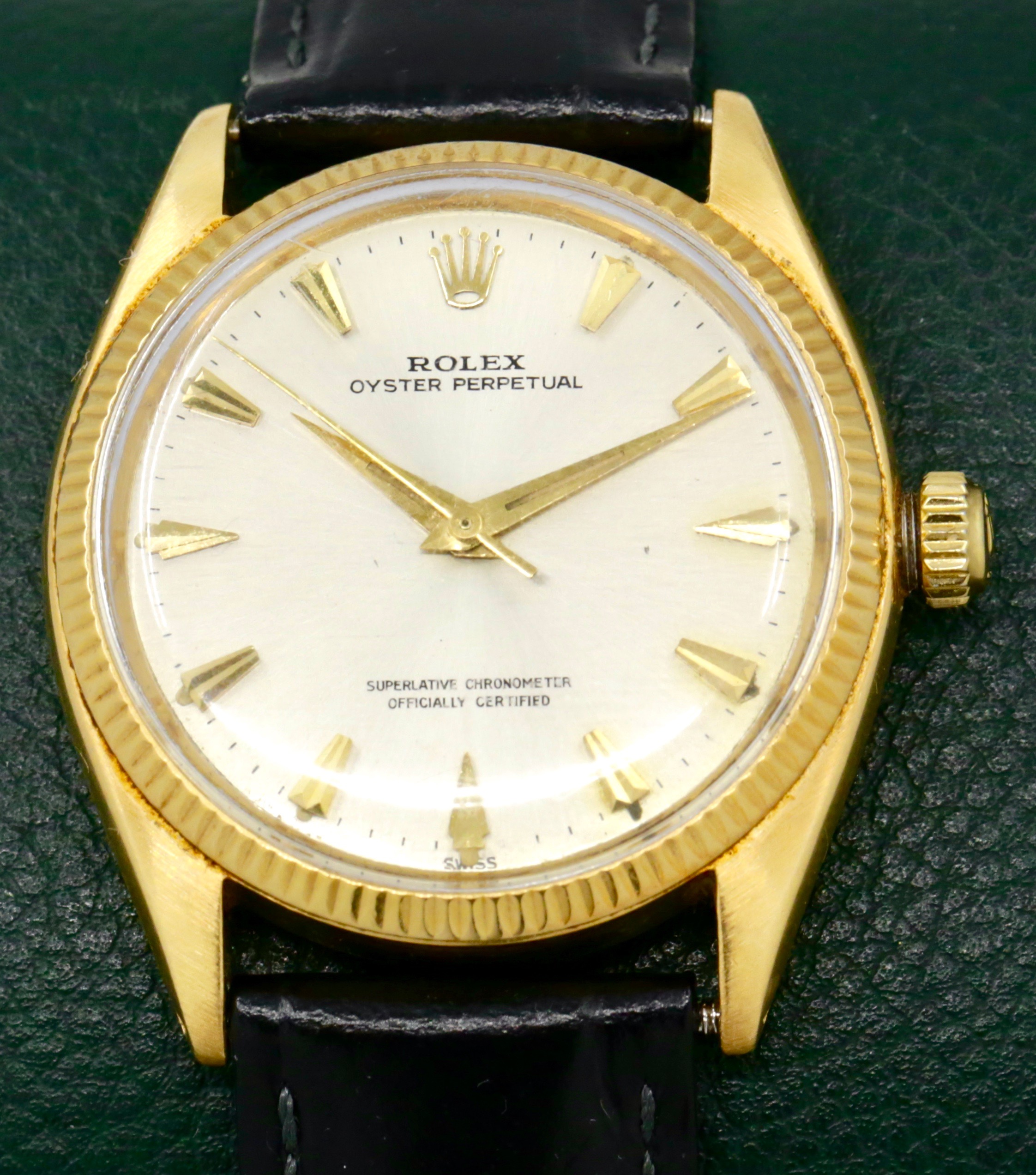 Rolex Oyster Perpetual in 18ct Yellow Gold , 18ct Fluted Bezel, Silver Index Dial, Rolex Calibre 1560, on a Black Leather Strap with a Rolex Gold Buckle. Ref: 1005, Ca. 1960's - $5,500 inc GST - *Sold as traded