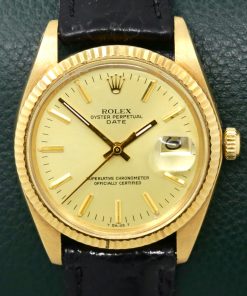 Rolex Oyster Perpetual Date 34mm in 18ct Yellow Gold, Champagne Index Dial with Date, on a Black Crocodile Strap with Rolex Tang Buckle. Ref: 1503, Circa 1979